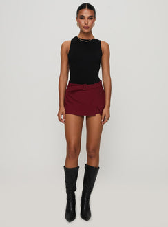 front view of model wearing Princess Polly Centre Stage Cut Out Bodysuit Black Sleeveless Bodysuit 