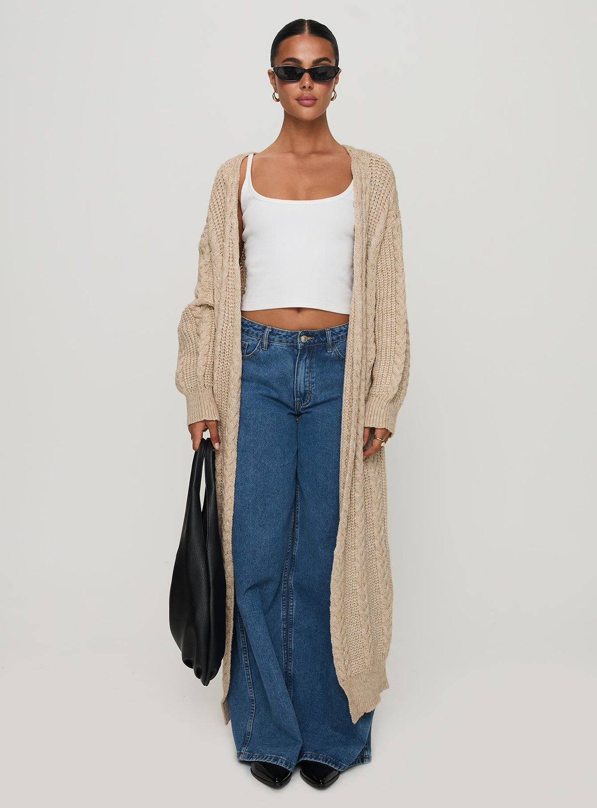 side view of model wearing Princess Polly Orkid Cable Knit Cardigan Beige Longline Jumpers Jumpers 