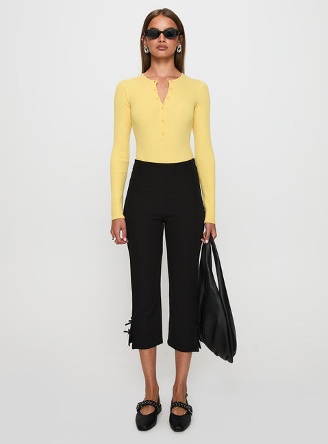 front view of model wearing Princess Polly Kerra Long Sleeve Bodysuit Lemon Long Sleeve Tops Bodysuit 