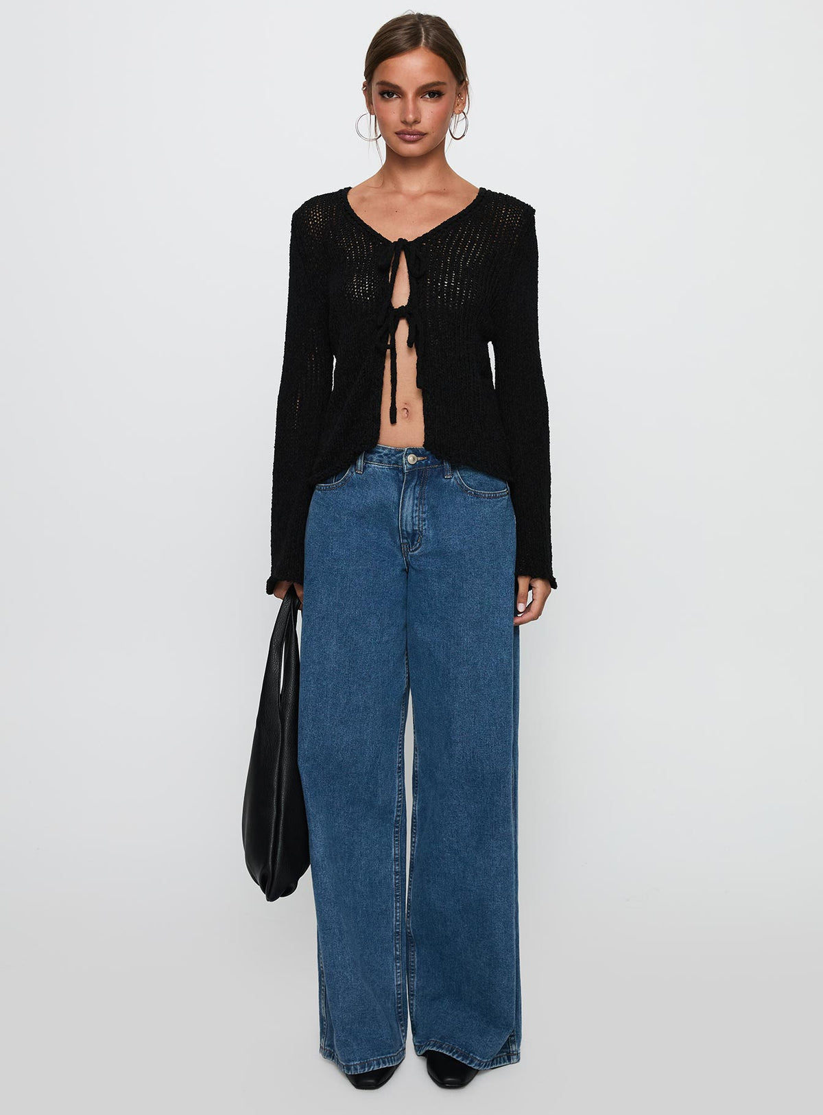 side view of model wearing Princess Polly Swain Knit Cardigan Black Cropped Jumpers Jumpers 