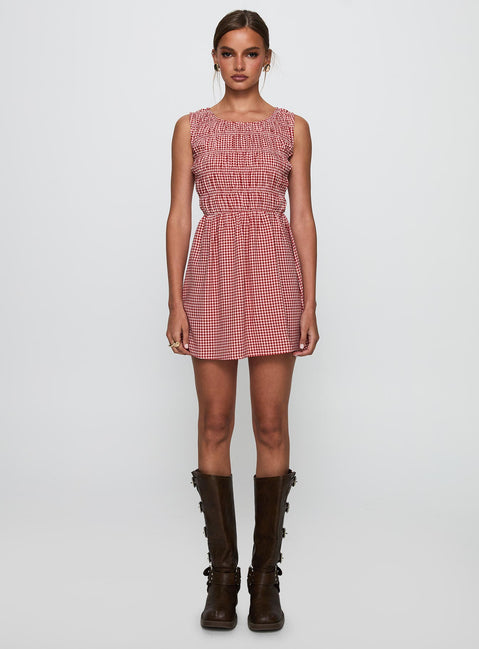side view of model wearing Princess Polly Winxie Shirred Mini Dress Red Gingham Scoop Neck 
