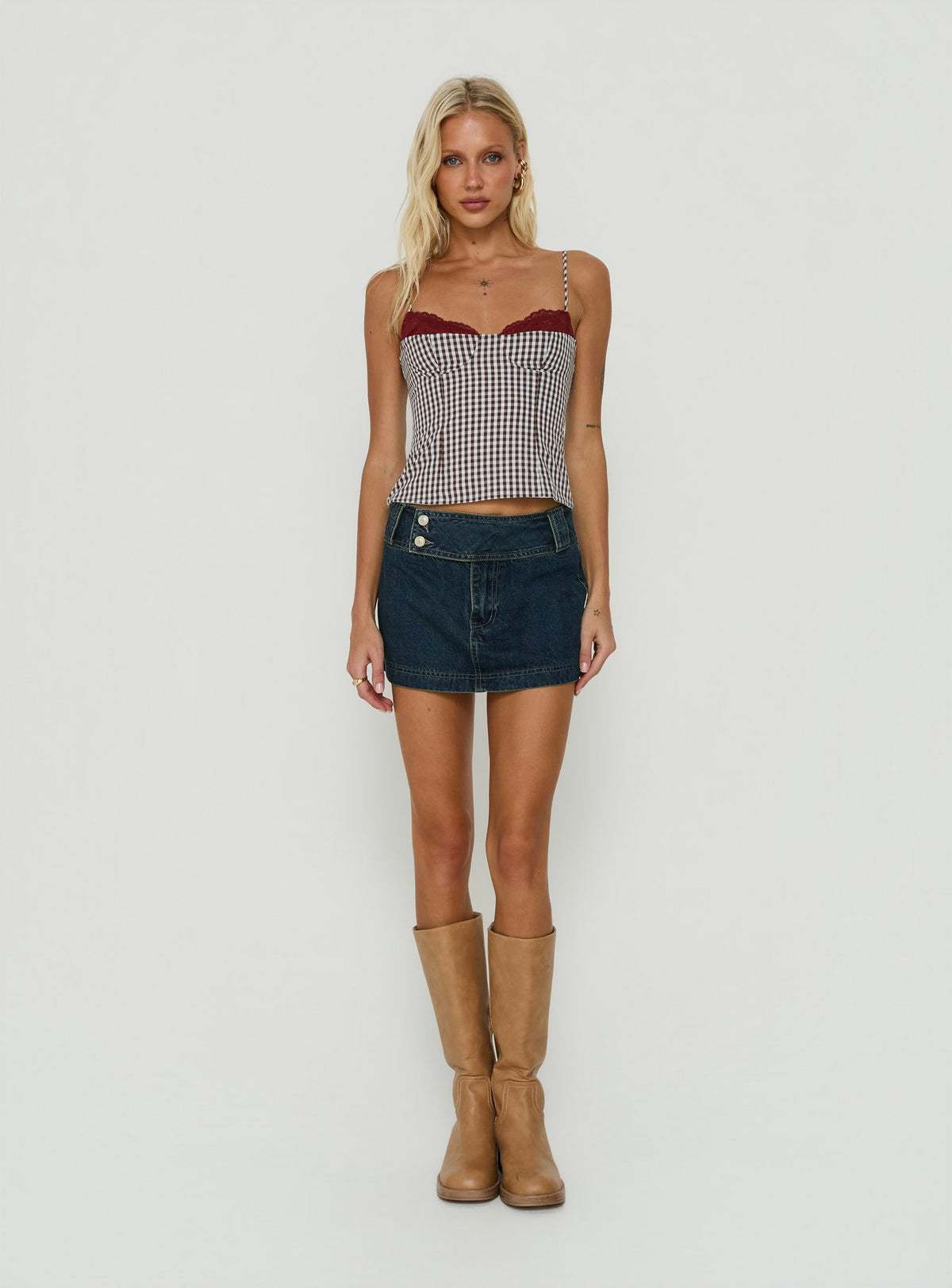 Designed with a-line shape, the Ladena Mid Rise Double Button Mini Skirt Raw Denim womens-skirts features frayed hem Princess Polly