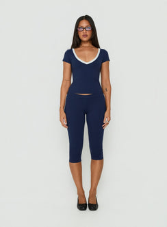 Experience the Rowanna Sporty Capri Pants Navy / Cream womens-regular-pants with high-rise front view of model wearing Princess Polly