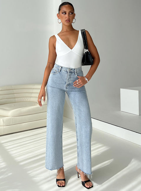 front view of model wearing Princess Polly Fawcett High Rise Straight Leg Jeans Light Blue Wash Petite High Rise Jeans Jeans 