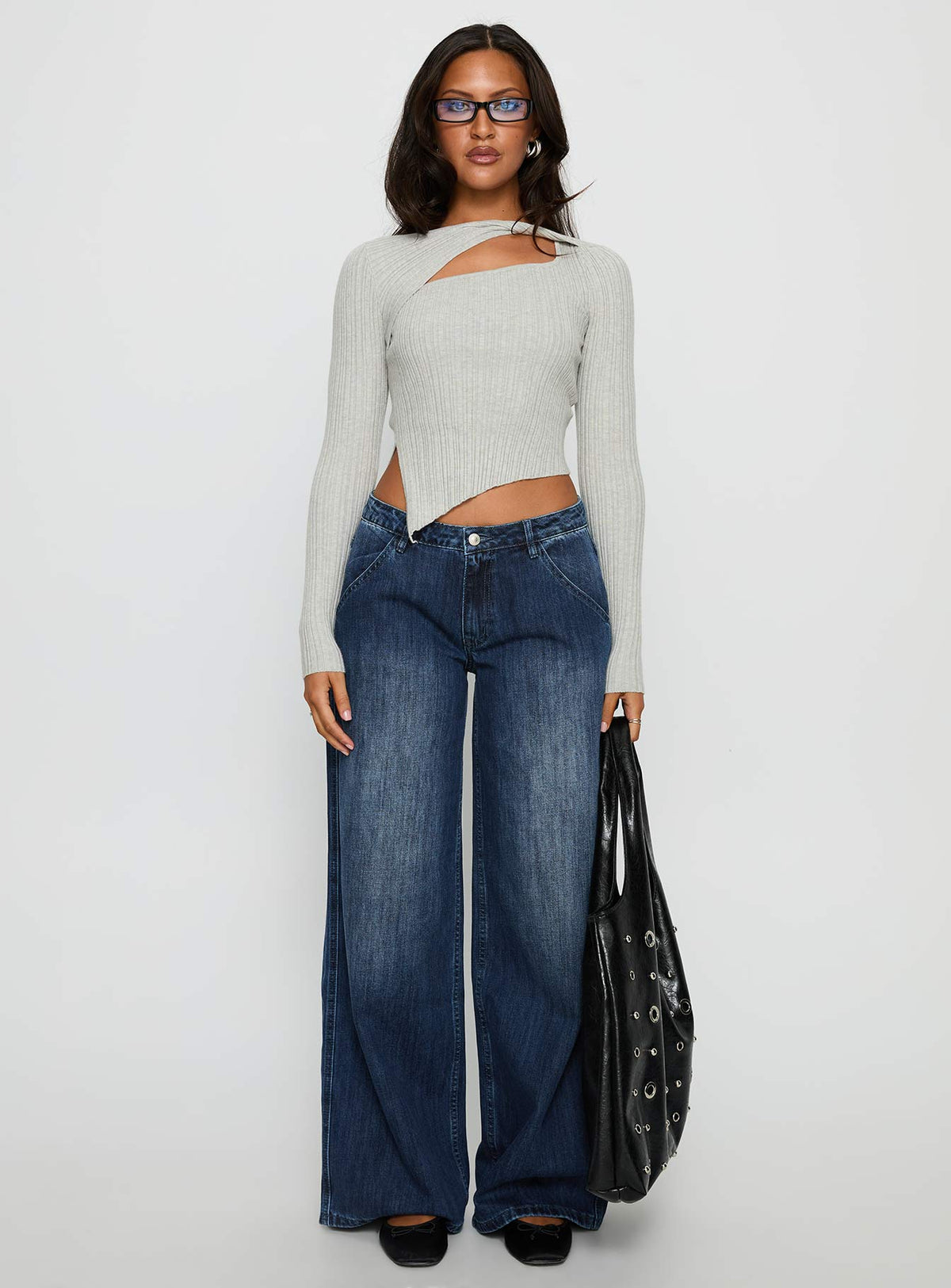 front view of model wearing Princess Polly Downtowner Low Rise Cargo Jeans Mid Blue Wash Low Rise Jeans Jeans 
