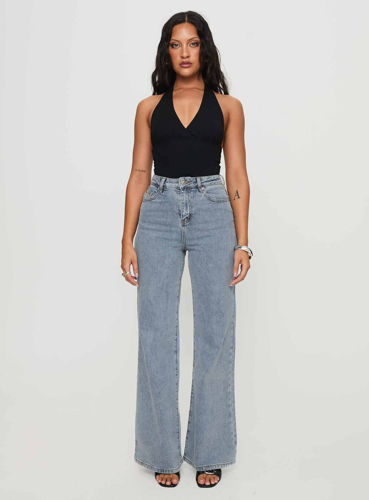side view of model wearing Princess Polly Thearlie High Flare Jean Light Wash High Waisted 