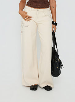 front view of model wearing Princess Polly Than Forever Love Graphic Denim Jeans Cream Low Rise Jeans Jeans 