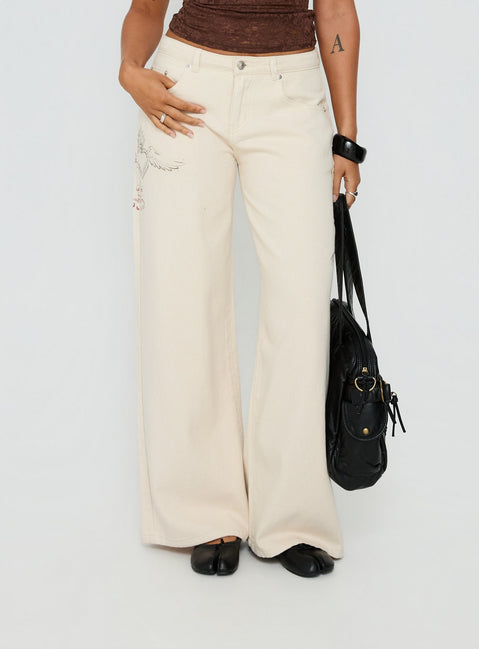 front view of model wearing Princess Polly Than Forever Love Graphic Denim Jeans Cream Low Rise Jeans Jeans 