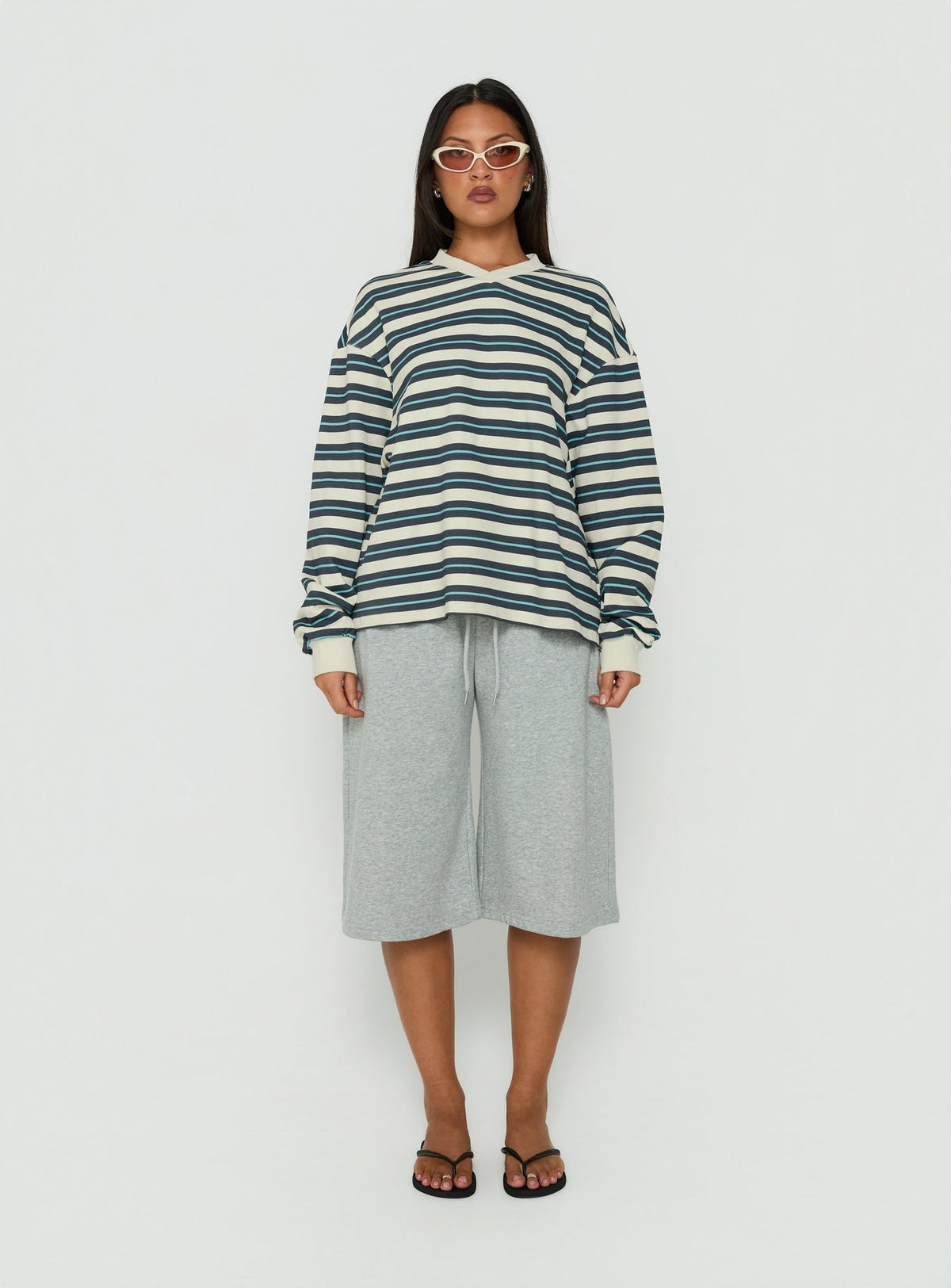 Showcasing the Opollo V Neck Jumper Blue Multi Stripe womens-jumpers with short length front view of model wearing Princess Polly