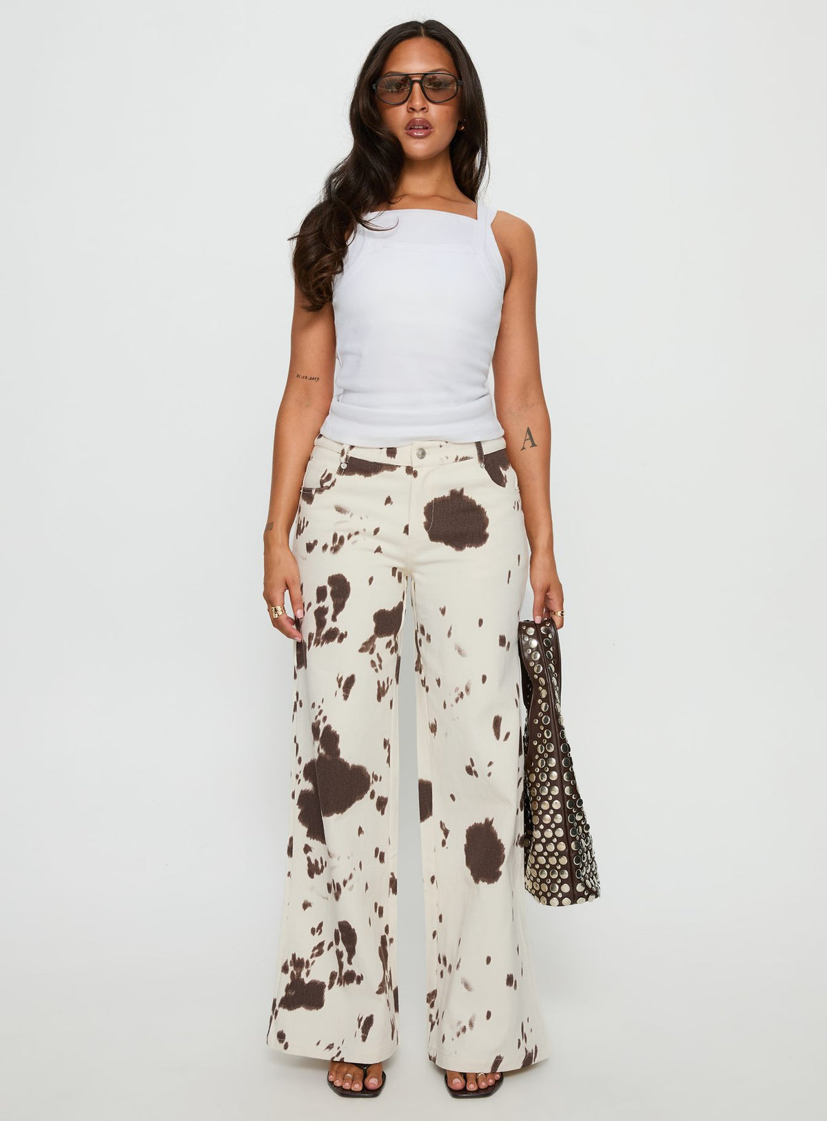 front view of model wearing Princess Polly Big Dreamer Low Rise Straight Leg Jeans Cow Print Low Rise Jeans Jeans 