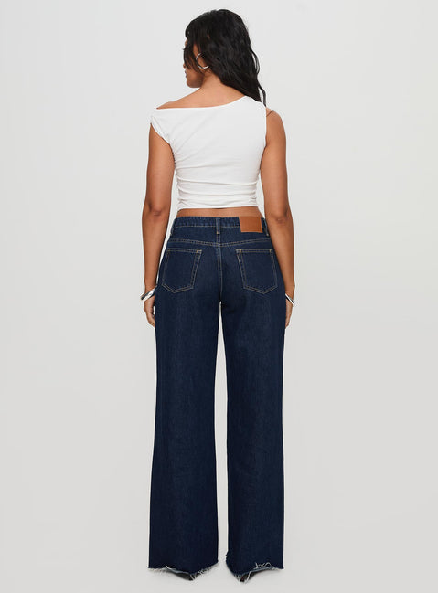 back view of model wearing Princess Polly Darla Low Rise Straight Jean Dark Wash Petite Low Rise Jeans 