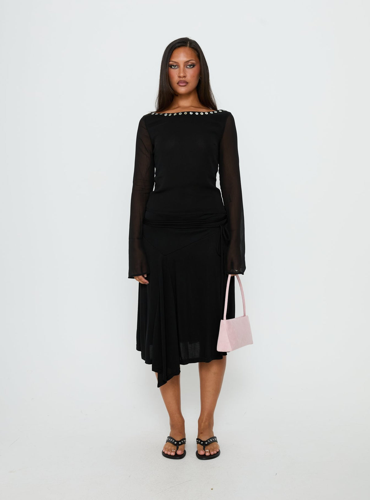   side view of model wearing Princess Polly Joaney Tie Side Jersey Midi Skirt Black Midi Skirts Skirts 