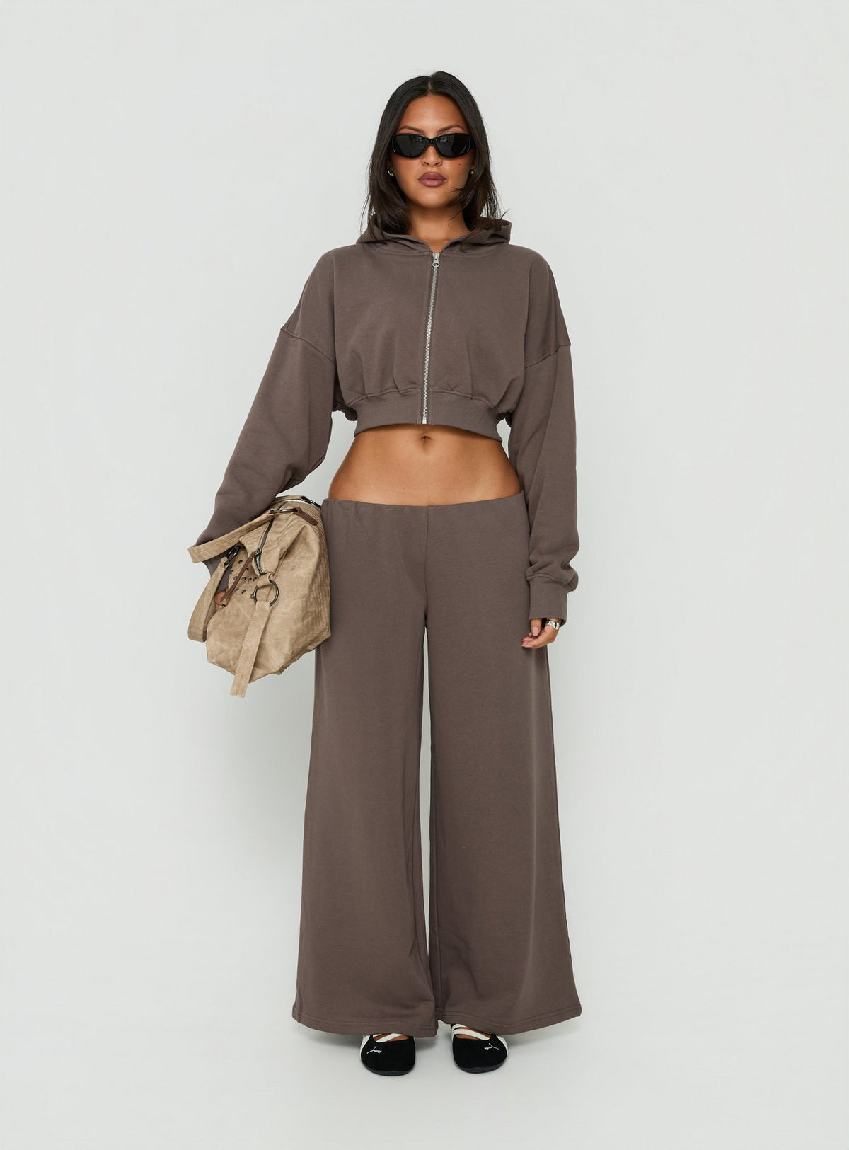Featuring Kaeya Fleece Wide Leg Low Rise Pants Grey womens-regular-pants with low-rise waist front view of model wearing Princess Polly