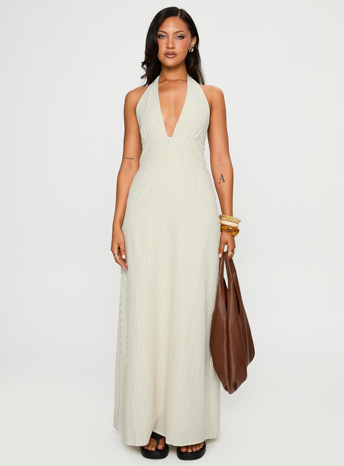 front view of model wearing Princess Polly Caralyn Halter Maxi Dress Multi Stripe Plunger 