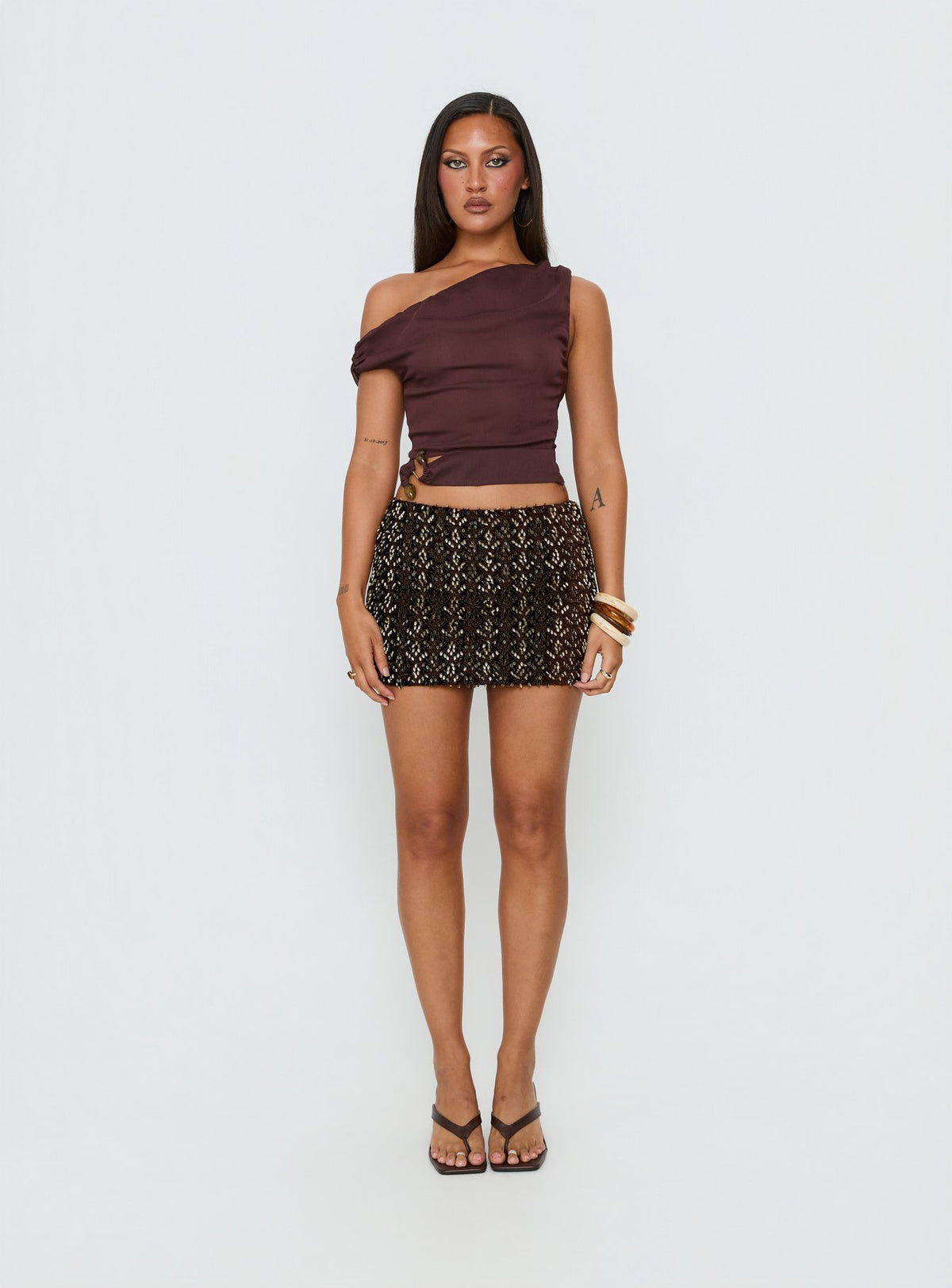 Showcase the Zaraya Sequin Mini Skirt Brown womens-skirts mini length front view of model wearing
