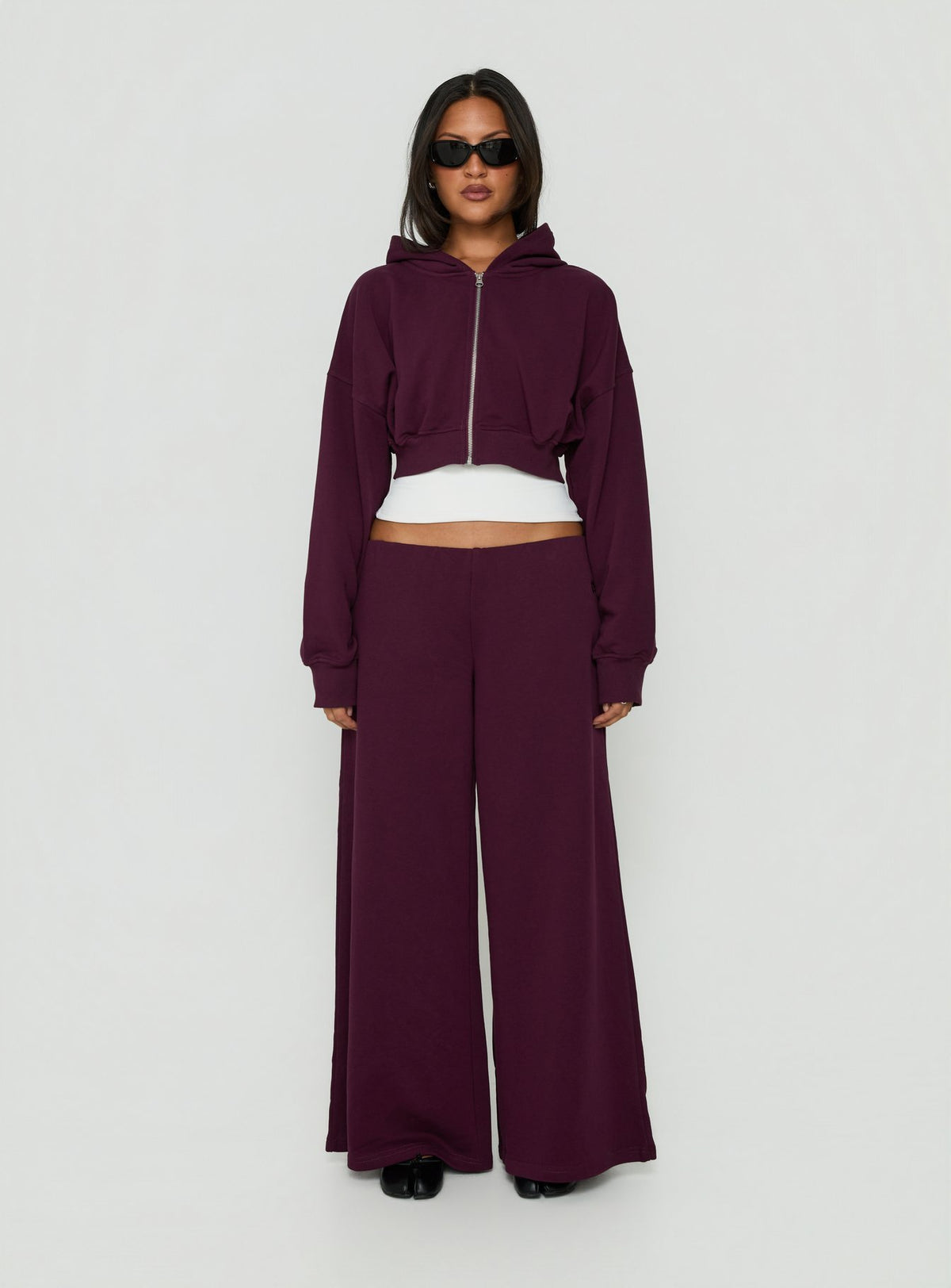Featuring Kaeya Fleece Wide Leg Low Rise Pants in Plum womens-regular-pants front view of model wearing Princess Polly