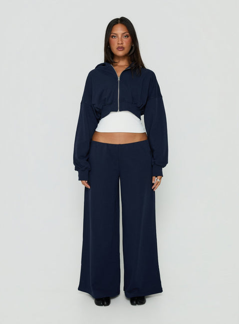 Showcasing the Lanna Fleece Zip Through Cropped Hoodie Navy womens-jumpers with short length front view of model wearing Princess Polly