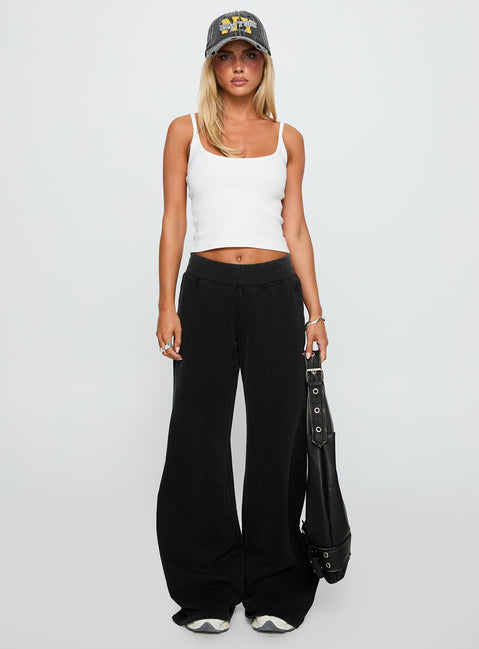 front view of model wearing Princess Polly Summits Flared Track Pants Washed Black High Rise Pants Pants 