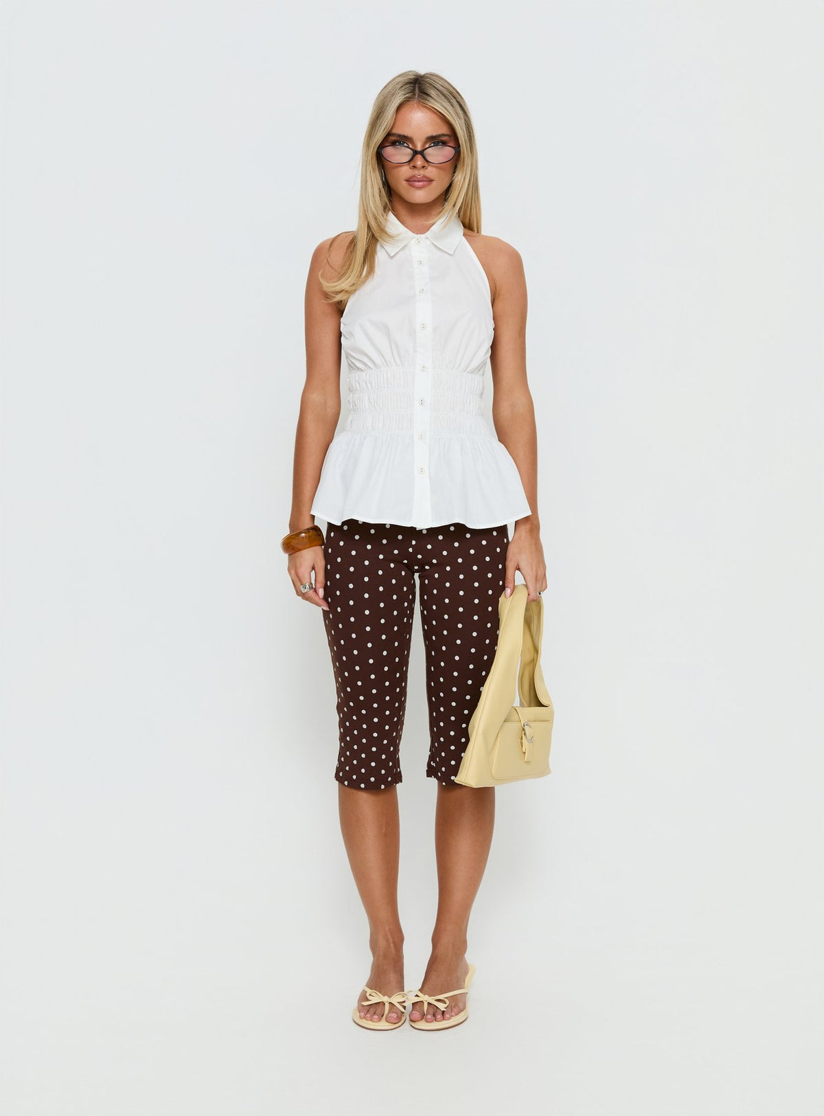 front view of model wearing Princess Polly Samaira Capri Pant Brown Polka Dot Mid Rise Pants Pants 