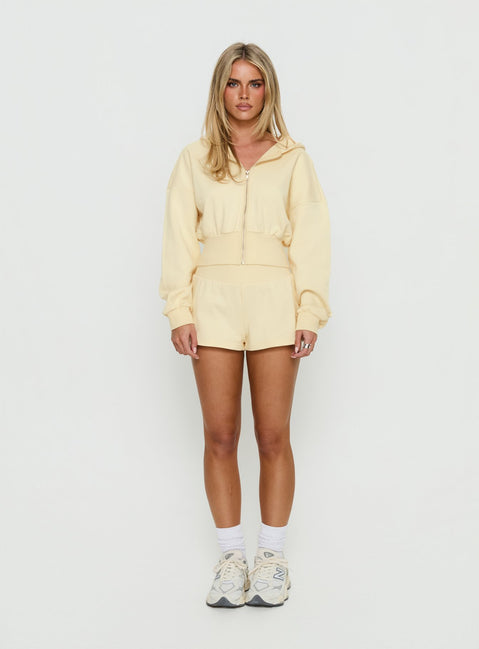 side view of model wearing Princess Polly Daytime Cropped Blouson Hoodie Buttercream Cropped Jumpers Jumpers 