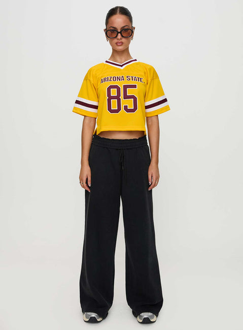 side view of model wearing Princess Polly ASU Football Jersey Gold Half Sleeves V-Neck 