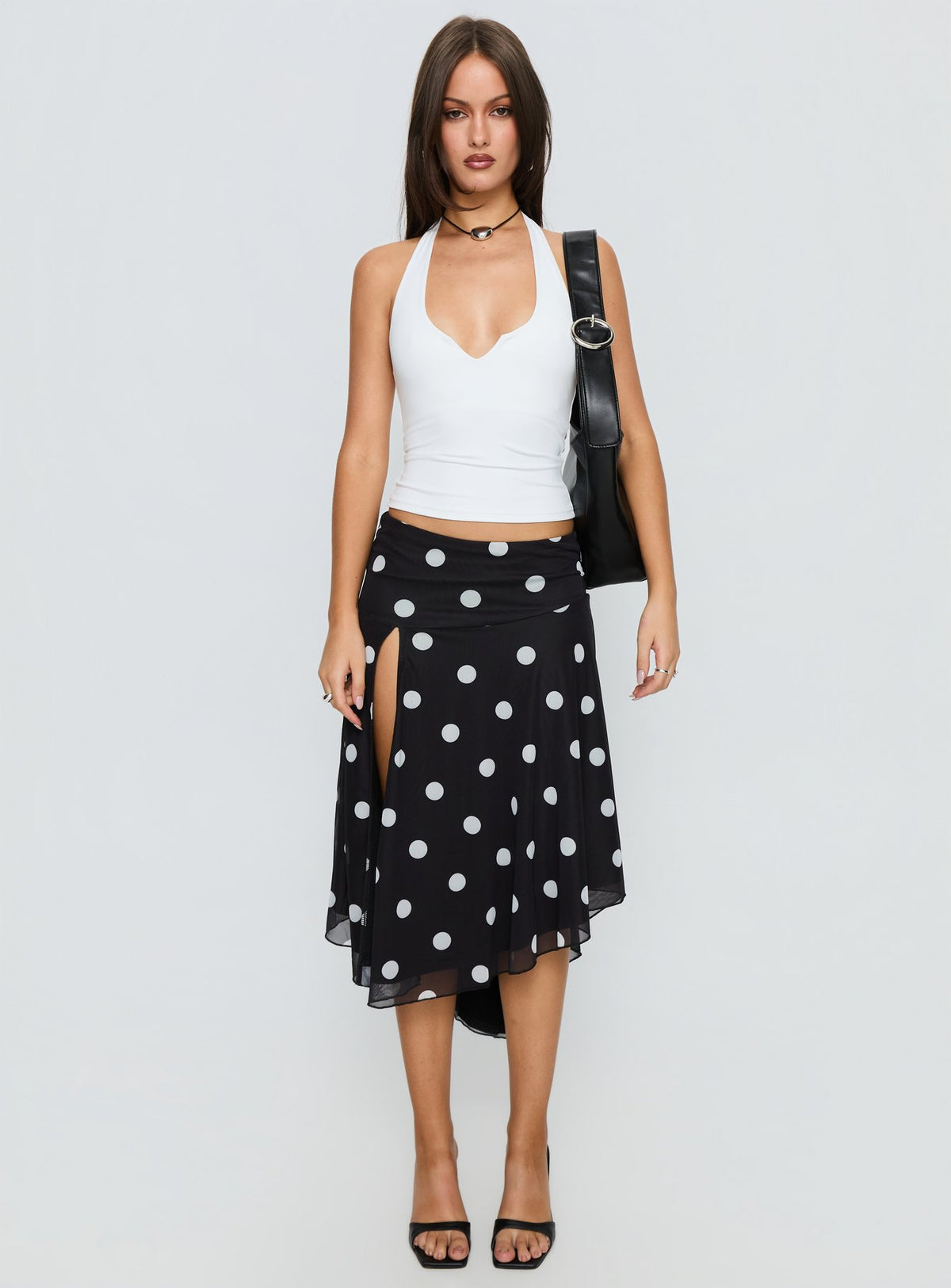   front view of model wearing Princess Polly Dulciana High Split Asymmetrical Midi Skirt Black / Polka Dot Midi Skirts Skirts 