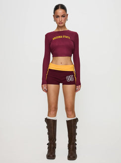 front view of model wearing Princess Polly ASU Foldover Shorts Maroon Low Rise Shorts 