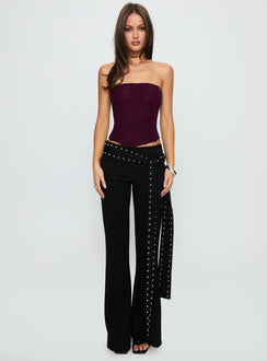side view of model wearing Princess Polly Nikolia Studded Wrap Belt Pants Black Mid Rise Pants Pants 