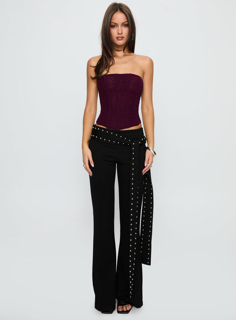 side view of model wearing Princess Polly Nikolia Studded Wrap Belt Pants Black Mid Rise Pants Pants 