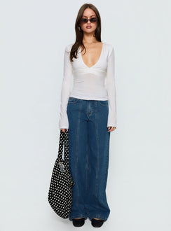 side view of model wearing Princess Polly Lando Low Rise Straight Leg Jeans Mid Blue Wash Mid Rise Jeans Jeans 