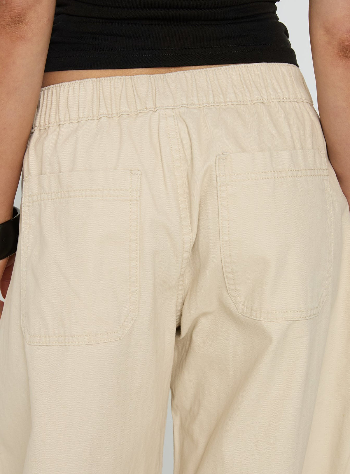 back view of model wearing Princess Polly Selective Memory Low Rise Wide Leg Cargo Pants Cream Low Rise Pants Pants 
