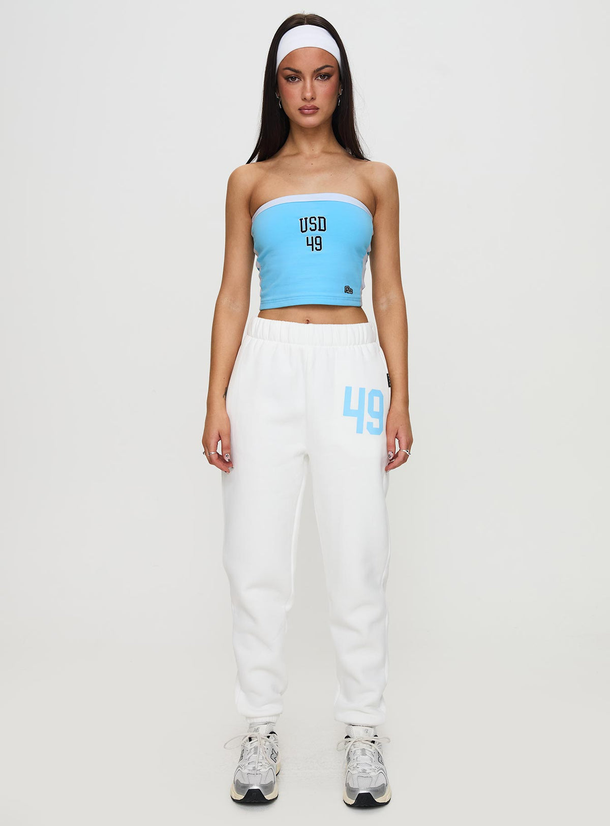 Crafted from USD Sweatpants White in womens-regular-pants with mid-rise waist, front view of model wearing Princess Polly