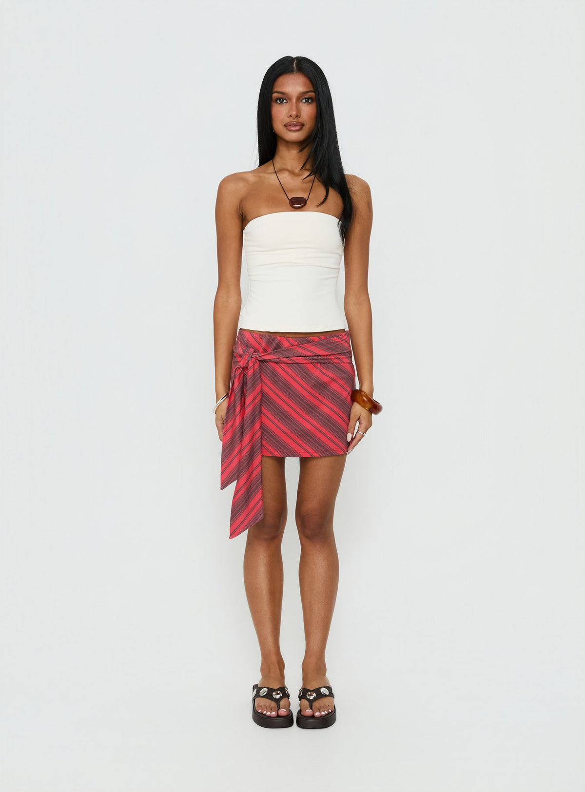   front view of model wearing Princess Polly Lindsy Tie Side Mini Skirt Red Multi Mini Skirts Skirts 
