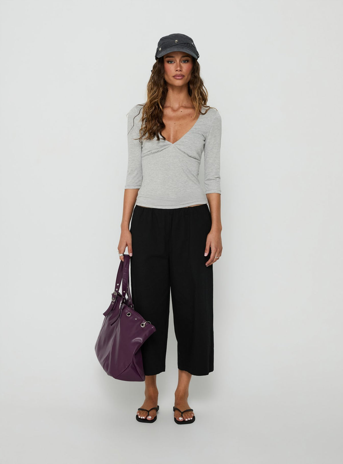 Featuring the Lunea Concealed Waistband 3/4 Pant Black Petite in womens-regular-pants with high-rise front view of model wearing Princess Polly