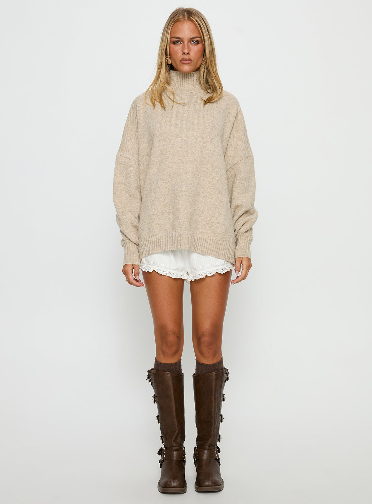 side view of model wearing Princess Polly Patrizia Funnel Neck Knit Sweater Beige Jumpers 