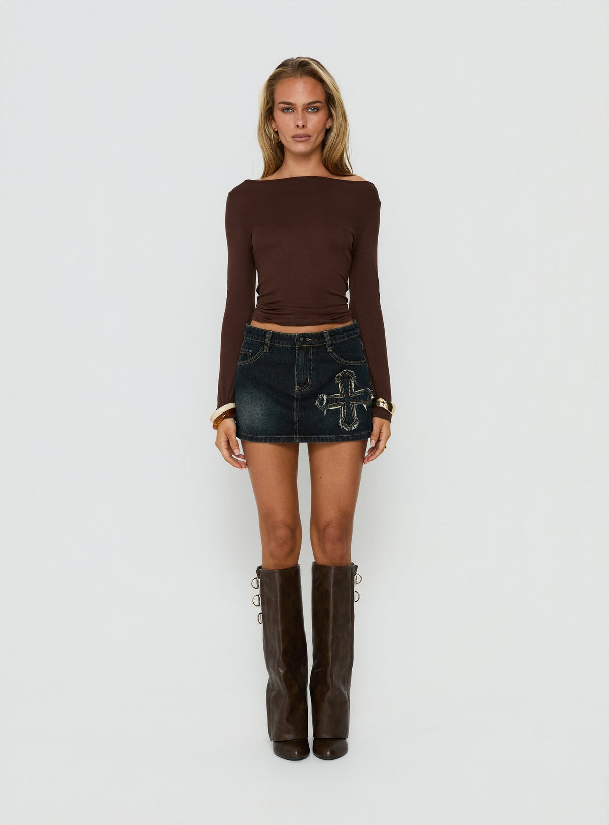 Showcasing the Barracuda Applique Denim Mini Skirt in Grunge Wash womens-skirts with fitted silhouette front view of model wearing Princess Polly