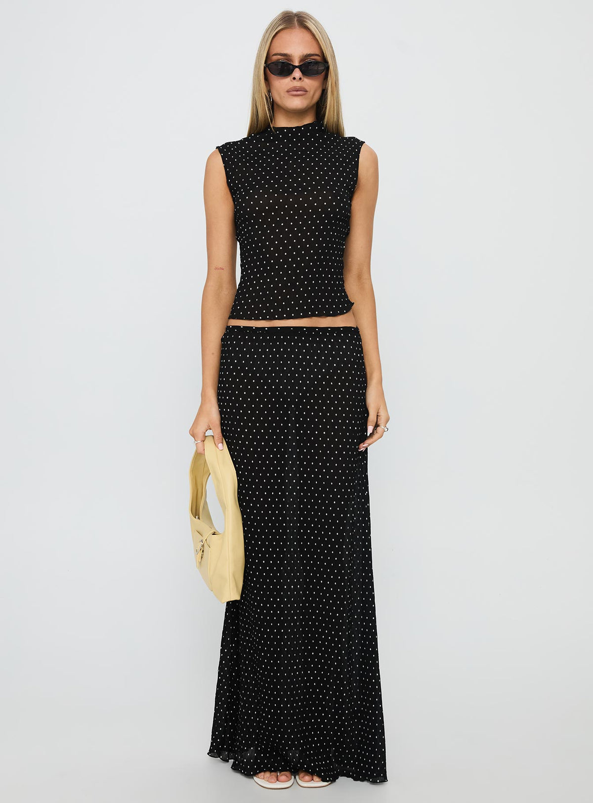   front view of model wearing Princess Polly Ford Maxi Skirt Onyx Polka Maxi 