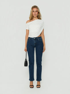 Presenting the Harpor Mid Rise Slim Skinny Jean Mid Blue Wash womens-jeans with belt on-body view of model wearing Princess Polly
