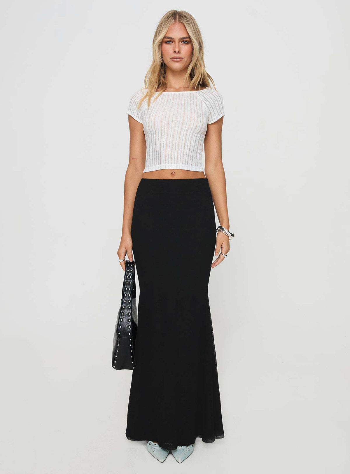   side view of model wearing Princess Polly Topping Maxi Skirt Black Maxi Skirts Skirts 