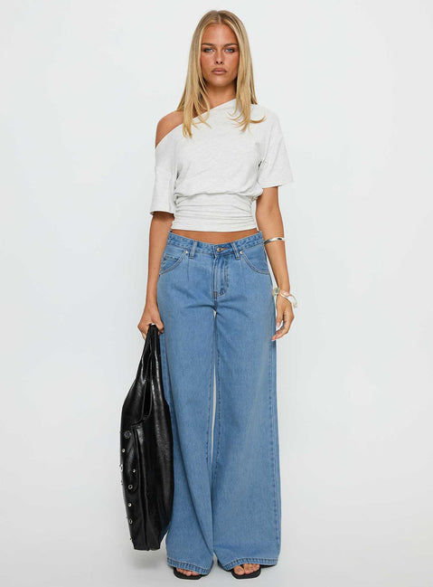 front view of model wearing Princess Polly Supercut Low Rise Baggy Pleat Jeans Light Blue Wash Low Rise Jeans Jeans 