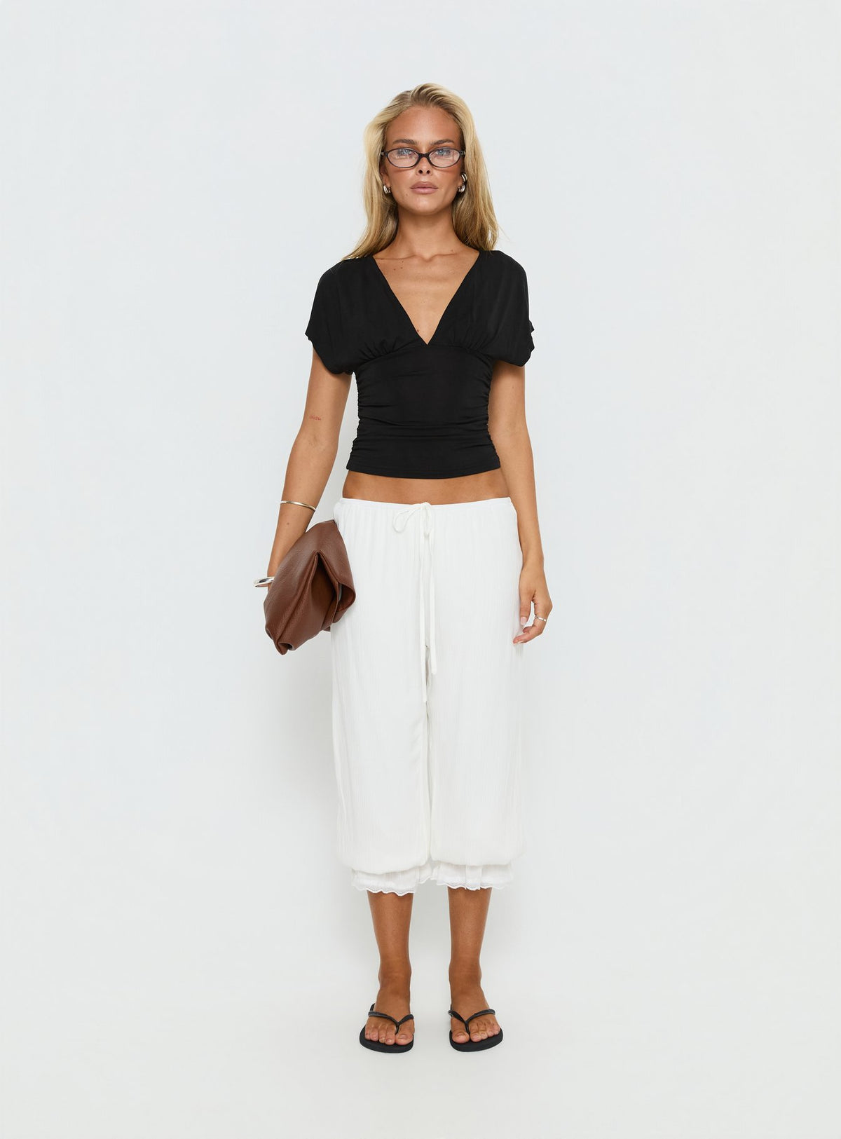 side view of model wearing Princess Polly Basma Bloomer Trouser Pants Rayon White Mid Rise Pants Pants 