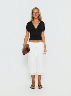 side view of model wearing Princess Polly Basma Bloomer Trouser Pants Rayon White Mid Rise Pants Pants 