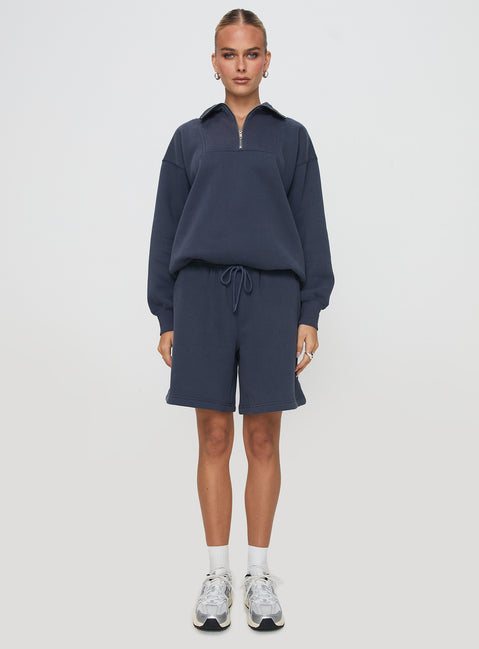 side view of model wearing Princess Polly Dream Fleece Quarter Zip Sweatshirt Navy Jumpers 