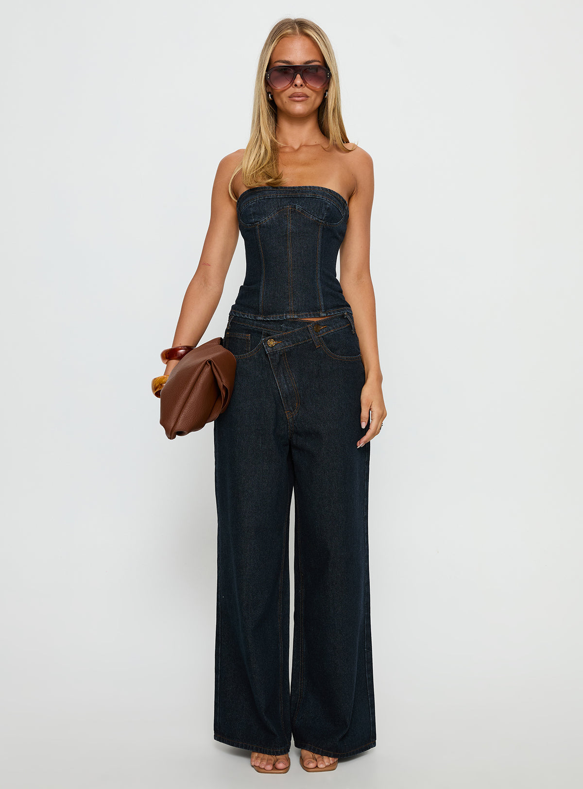 front view of model wearing Princess Polly Blue Crush Low Rise Wide Leg Jeans Indigo Mid Rise Jeans Jeans 