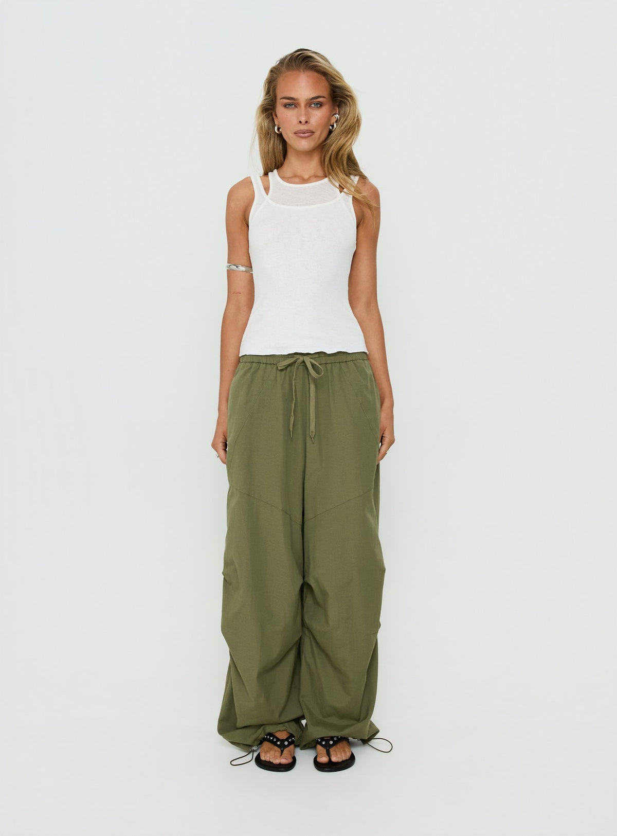Discover the Mankind Baggy Cargo Pants Olive in womens-regular-pants with mid-rise waist front view of model wearing Princess Polly