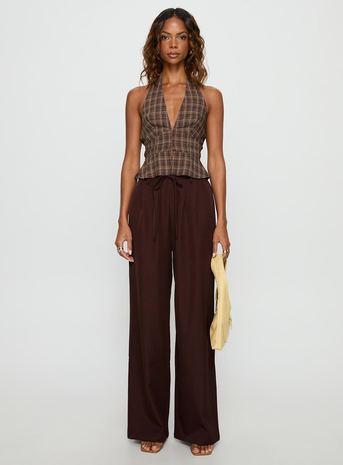 front view of model wearing Princess Polly Idolised Pleated Tie Waist Pant Chocolate Brown Mid Rise Pants 