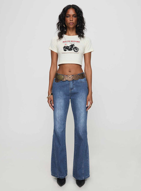 front view of model wearing Princess Polly Leslee Mid Rise Flare Jean Mid Wash Blue Mid Rise Jeans Jeans 