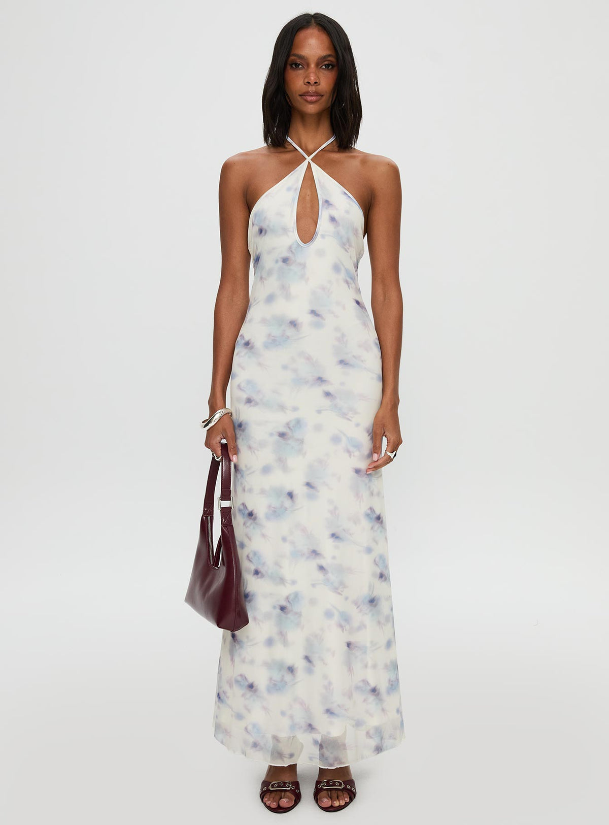 side view of model wearing Princess Polly Walk On Water Halter Maxi Dress White Plunger 