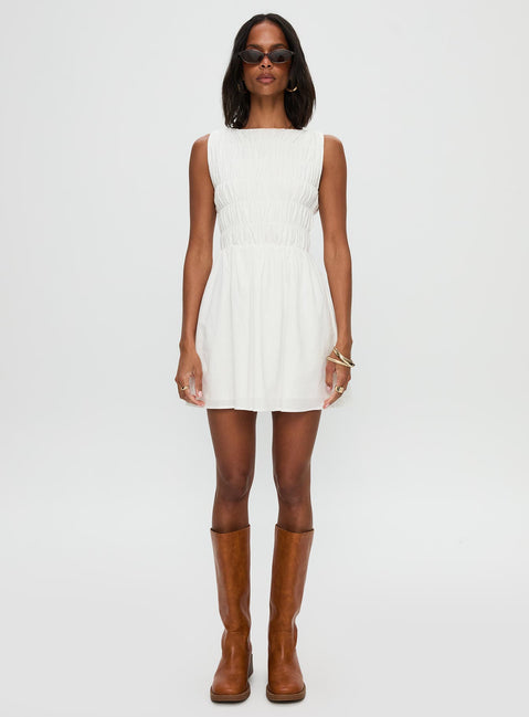 front view of model wearing Princess Polly Melona Shirred Mini Dress White Boat Neck 