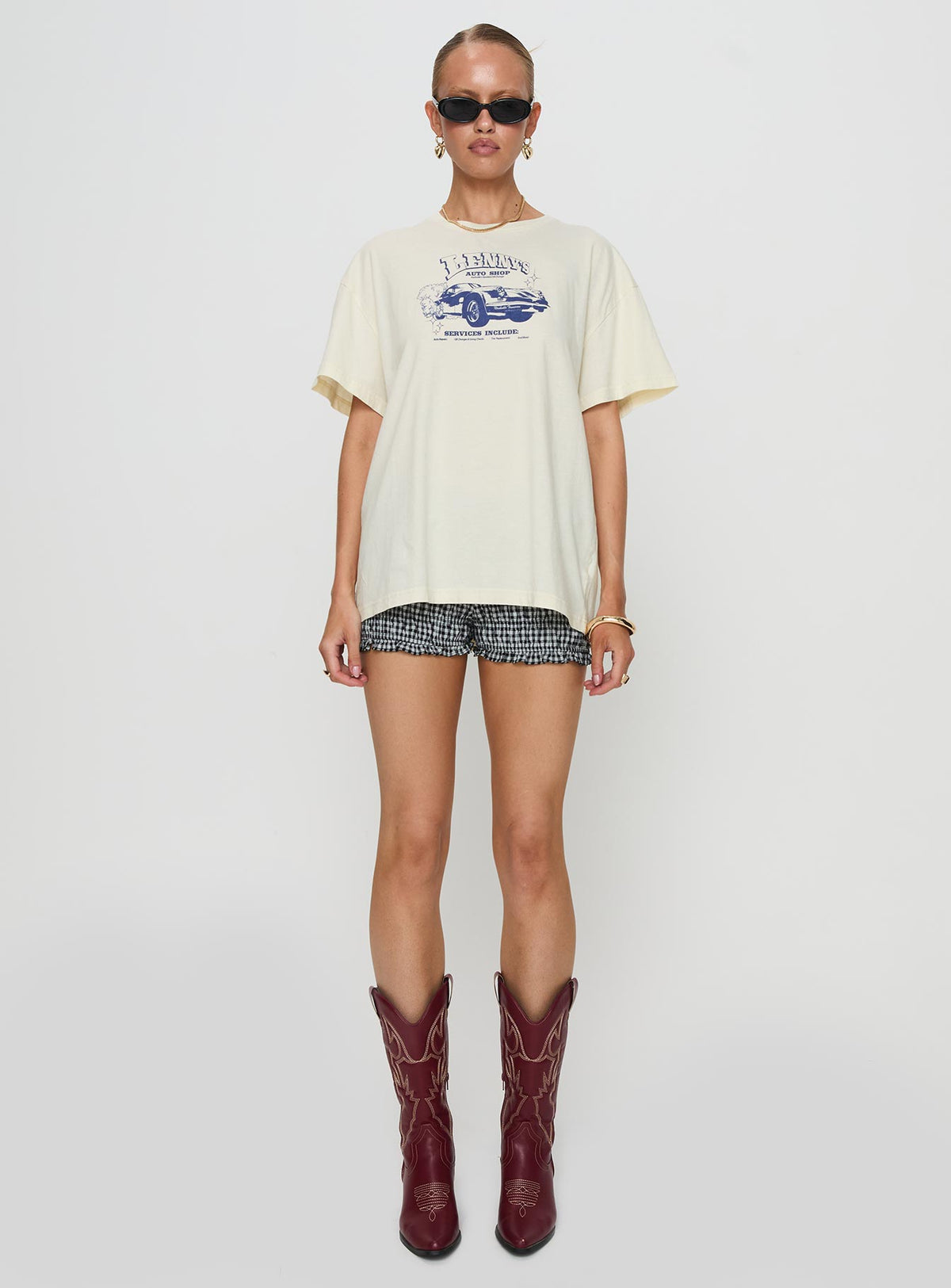 side view of model wearing Princess Polly Lennys Auto Oversized Tee Cream Half Sleeves Crew Neck 